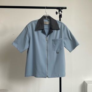 Necessity Sense baby blue zip up short sleeve shirt. Contrasts collar, size S